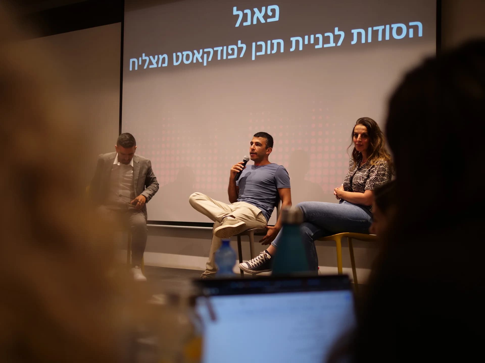 Dani taking part in a three-person panel discussion