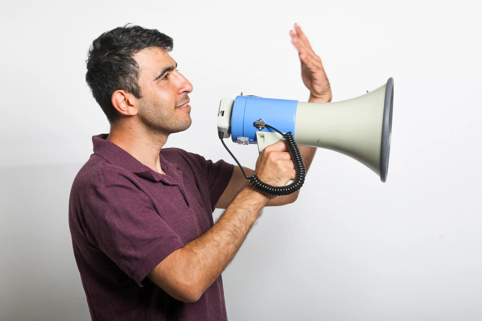 Dani Gadayev holding a megaphone